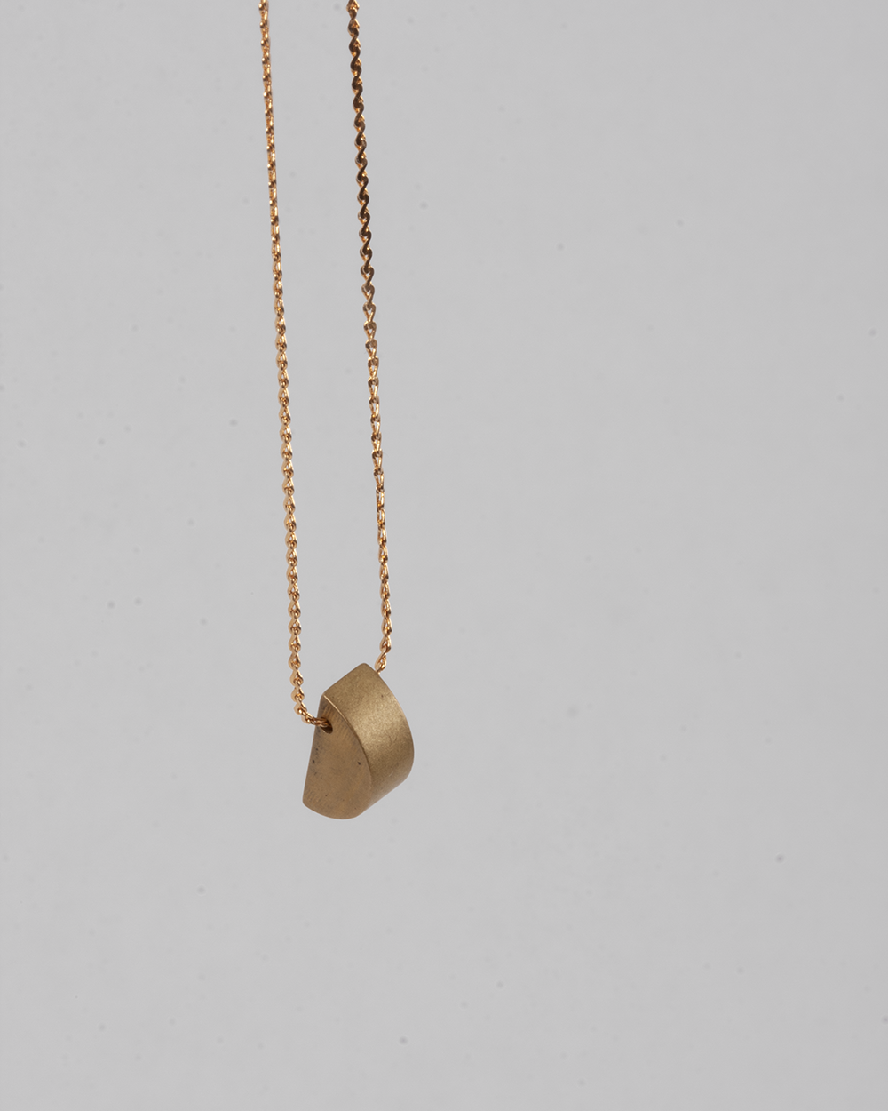 Brass semi circle necklace.